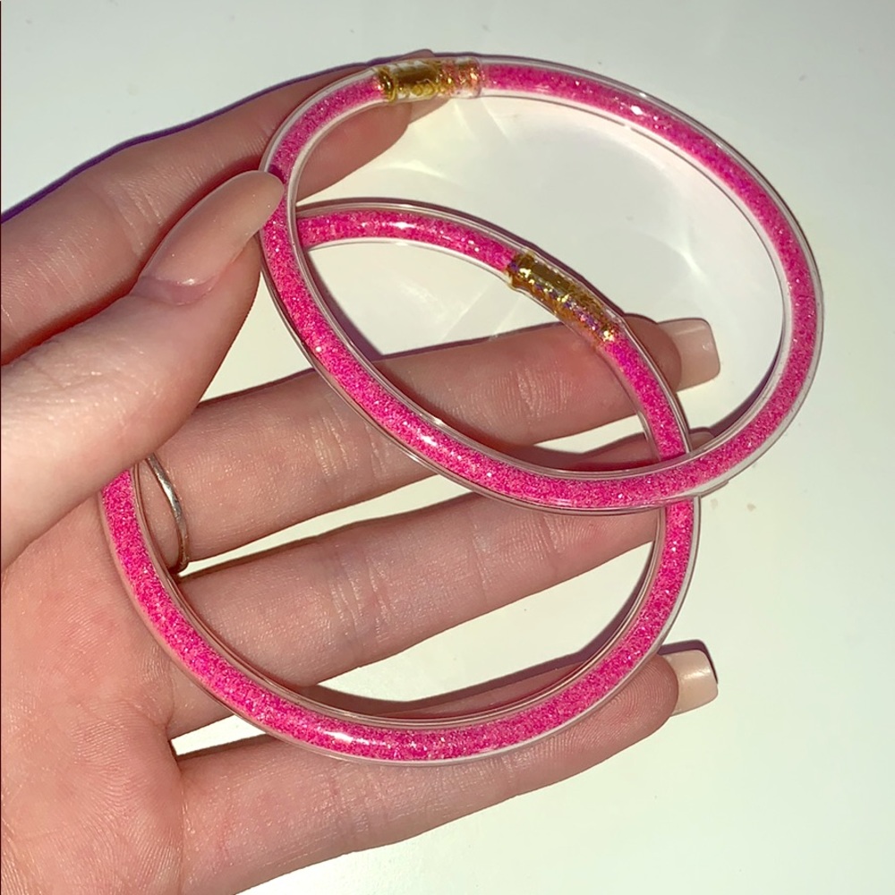 two pink swimming bracelets